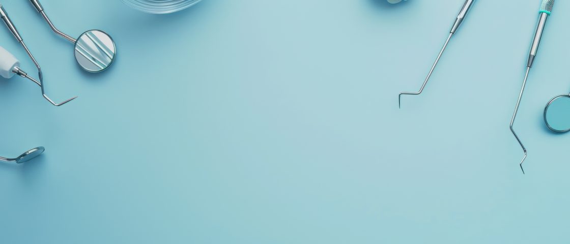 equipment for checking teeth on a blue background, top view